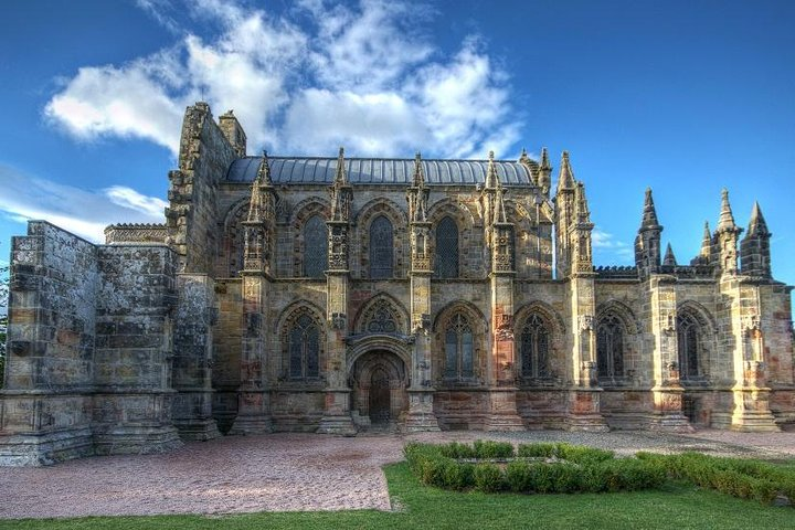 Uncover the rich history and intricate architecture of Rosslyn Chapel nestled in the lush Scottish Borders while enjoying scenic views that inspire wonder and reflection.
